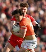 14 May 2023; James Morgan of Armagh in action against Eoghan McEvoy of Derry during the Ulster GAA Football Senior Championship Final match between Armagh and Derry at St Tiernach’s Park in Clones, Monaghan. Photo by Ramsey Cardy/Sportsfile