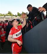 14 May 2023; Niall Toner of Derry celebrates with supporters after the Ulster GAA Football Senior Championship Final match between Armagh and Derry at St Tiernach’s Park in Clones, Monaghan. Photo by Ramsey Cardy/Sportsfile
