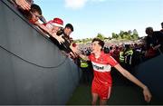 14 May 2023; Paul Cassidy of Derry celebrates with supporters after the Ulster GAA Football Senior Championship Final match between Armagh and Derry at St Tiernach’s Park in Clones, Monaghan. Photo by Ramsey Cardy/Sportsfile