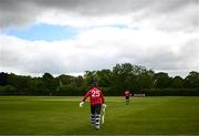 15 May 2023; Murray Commins of Munster Reds makes his way out to bat during the Cricket Ireland Inter-Provincial Series match between Munster Reds and North West Warriors at The Mardyke in Cork. Photo by Eóin Noonan/Sportsfile