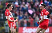 14 May 2023; Shane McGuigan of Derry, left, celebrates with Conor McCluskey after kicking an extra-time point during the Ulster GAA Football Senior Championship Final match between Armagh and Derry at St Tiernach’s Park in Clones, Monaghan. Photo by Ramsey Cardy/Sportsfile