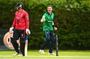 15 May 2023; Ryan Macbeth of North West Warriors celebrates after taking the wicket of Brandon Kruger of Munster Reds during the Cricket Ireland Inter-Provincial Series match between Munster Reds and North West Warriors at The Mardyke in Cork. Photo by Eóin Noonan/Sportsfile