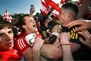 14 May 2023; Derry players Brendan Rogers, left, and goalkeeper Odhran Lynch celebrate after their victory in the Ulster GAA Football Senior Championship Final match between Armagh and Derry at St Tiernach’s Park in Clones, Monaghan. Photo by Ramsey Cardy/Sportsfile