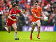 14 May 2023; Jarly Óg Burns of Armagh in action against Paul Cassidy of Derry during the Ulster GAA Football Senior Championship Final match between Armagh and Derry at St Tiernach’s Park in Clones, Monaghan. Photo by Ramsey Cardy/Sportsfile