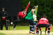 15 May 2023; Ben White of Munster Reds delivers to Shane Getkate of North West Warriors during the Cricket Ireland Inter-Provincial Series match between Munster Reds and North West Warriors at The Mardyke in Cork. Photo by Eóin Noonan/Sportsfile