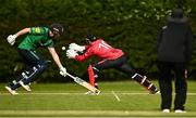 15 May 2023; Shane Getkate of North West Warriors in action against PJ Moore of Munster Reds during the Cricket Ireland Inter-Provincial Series match between Munster Reds and North West Warriors at The Mardyke in Cork. Photo by Eóin Noonan/Sportsfile