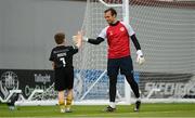 15 May 2023; St Patrick's Athletic goalkeeper Dean Lyness with Adam McGill, son of St Patrick's Athletic Equipment Manager David McGill, wearing the jersey of St Patrick's Athletic goalkeeper Danny Rogers before the SSE Airtricity Men's Premier Division match between Shamrock Rovers and St Patrick's Athletic at Tallaght Stadium in Dublin. Photo by Stephen McCarthy/Sportsfile