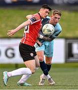 15 May 2023; Cian Kavanagh of Derry City in action against Hayden Muller of Dundalk during the SSE Airtricity Men's Premier Division match between Derry City and Dundalk at The Ryan McBride Brandywell Stadium in Derry. Photo by Ramsey Cardy/Sportsfile