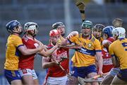15 May 2023; Ben O'Connor of Cork, centre, eyes up possession as teammate Timmy Wilk, left, claims it during the oneills.com Munster GAA Hurling U20 Championship Final match between Cork and Clare at TUS Gaelic Grounds in Limerick. Photo by Piaras Ó Mídheach/Sportsfile