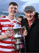 15 May 2023; Cork goalkeeper Brion Saunderson celebrates with his grandfather Bobby Brohan after his side's victory in the oneills.com Munster GAA Hurling U20 Championship Final match between Cork and Clare at TUS Gaelic Grounds in Limerick. Photo by Piaras Ó Mídheach/Sportsfile