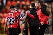 15 May 2023; Mark Connolly, right, congratulates Derry City teammate Adam O'Reilly after the SSE Airtricity Men's Premier Division match between Derry City and Dundalk at The Ryan McBride Brandywell Stadium in Derry. Photo by Ramsey Cardy/Sportsfile