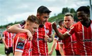 15 May 2023; Brandon Kavanagh of Derry City celebrates with teammates Cian Kavanagh, centre, and Sadou Diallo, right, after scoring their side's second goal during the SSE Airtricity Men's Premier Division match between Derry City and Dundalk at The Ryan McBride Brandywell Stadium in Derry. Photo by Ramsey Cardy/Sportsfile