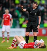 15 May 2023; Referee Damien MacGraith with Jason McClelland of St Patrick's Athletic during the SSE Airtricity Men's Premier Division match between Shamrock Rovers and St Patrick's Athletic at Tallaght Stadium in Dublin. Photo by Stephen McCarthy/Sportsfile