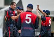 16 May 2023; Tom Mayes of Northern Knights, left, celebrates with teammates after taking the wicket of Simi Singh of Leinster Lightning during the CI Inter-Provincial Series 2023 match between Leinster Lightning and Northern Knights at Pembroke Cricket Club in Dublin. Photo by Brendan Moran/Sportsfile