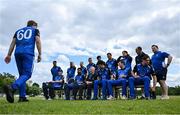 16 May 2023; The Leinster Lightning team await teammate Barry McCarthy, left, as they sit for a team photograph during a break in play in the CI Inter-Provincial Series 2023 match between Leinster Lightning and Northern Knights at Pembroke Cricket Club in Dublin. Photo by Brendan Moran/Sportsfile
