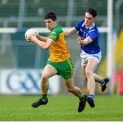 13 May 2023; Finbar Roarty of Donegal is tackled by Jensen Tynan of Cavan during the Ulster GAA Minor Football Championship Quarter-Final match between Cavan and Donegal at Kingspan Breffni in Cavan. Photo by Stephen McCarthy/Sportsfile