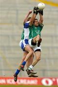 13 June 2004; Andrew Bready, Limerick, supported by team-mate Dermot Phelan, hidden, wins possession against Sean Dempsey, Waterford. Munster Junior Football Championship Semi-Final, Limerick v Waterford, Gaelic Grounds, Limerick. Picture credit; Pat Murphy / SPORTSFILE