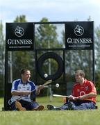 21 June 2004; Rival captains Ken McGrath, left, and Ben O'Connor, Cork, go head to head in advance of the Guinness Hunster Hurling Final. Ken and Ben are pictured testing their skills at the launch of the Guinness Training Booth, which makes it's debut appearance at next Sunday's Guinness Munster Hurling Final in Thurles. Picture credit; Brendan Moran / SPORTSFILE