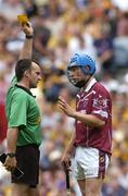 13 June 2004; Referee Diarmuid Kirwan issues Westmeath's Paul Greville with a yellow card. Guinness Leinster Senior Hurling Championship Quarter-Final, Dublin v Westmeath, Croke Park, Dublin. Picture credit; Brian Lawless / SPORTSFILE