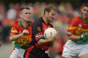 12 June 2004; Alan Molloy, Down in action against Simon Rea, Carlow. Bank of Ireland Football Championship Qualifier, Round 1, Carlow v Down, Dr. Cullen Park, Carlow. Picture credit; Damien Eagers / SPORTSFILE