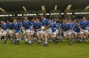 13 June 2004; The Cavan team break away  from the bench after having had their photograph taken. Bank of Ireland Ulster Senior Football Championship Semi-Final, Cavan v Armagh, St. Tighernach's Park, Clones, Co. Monaghan. Picture credit; Damien Eagers / SPORTSFILE