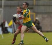 20 June 2004; Shane Sweeney, Tyrone, in action against Brendan Devenney, Donegal. Bank of Ireland Ulster Senior Football Championship Semi-Final, Donegal v Tyrone, St. Tighernach's Park, Clones, Co. Monaghan. Picture credit; Pat Murphy / SPORTSFILE