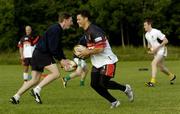 21 June 2004; Bradford Bulls' Robbie Paul, right, and Meath's Trevor Giles in action during a Meath football and Bradford Bulls Rugby League training session. Dalgan Park, Navan, Co. Meath. Picture credit; Damien Eagers / SPORTSFILE