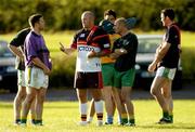 21 June 2004; Meath players, from l to r, Mark O'Reilly, Paddy Reynolds and David Gallagher listen to Bradford Bulls assistant coach Phil Veivers during a Meath football and Bradford Bulls Rugby League training session. Dalgan Park, Navan, Co. Meath. Picture credit; Damien Eagers / SPORTSFILE
