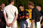 21 June 2004; Bradford Bulls captain Robbie Paul in jovial mood with Meath's, from l to r, David Beggy, selector, Nigel Crawford and Graham Geraghty at a Meath football and Bradford Bulls Rugby League training session. Dalgan Park, Navan, Co. Meath. Picture credit; Damien Eagers / SPORTSFILE