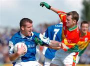 30 May 2004; Colm Byrne, Laois, in action against Mark Carpenter, Carlow. Bank of Ireland Leinster Senior Football Championship, Carlow v Laois, Dr. Cullen Park, Carlow. Picture credit; David Maher / SPORTSFILE