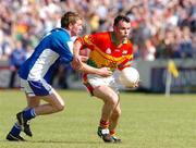 30 May 2004; Johnny Nevin, Carlow, in action against Paul McDonald, Laois. Bank of Ireland Leinster Senior Football Championship, Carlow v Laois, Dr. Cullen Park, Carlow. Picture credit; David Maher / SPORTSFILE