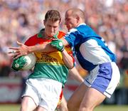 30 May 2004; Mark Carpenter, Carlow, in action against Tom Kelly, Laois. Bank of Ireland Leinster Senior Football Championship, Carlow v Laois, Dr. Cullen Park, Carlow. Picture credit; David Maher / SPORTSFILE