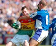 30 May 2004; Mark Carpenter, Carlow, in action against Tom Kelly, Laois. Bank of Ireland Leinster Senior Football Championship, Carlow v Laois, Dr. Cullen Park, Carlow. Picture credit; David Maher / SPORTSFILE