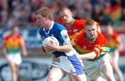 30 May 2004; Paul McDonald, Laois, in action against Brian Kelly, Carlow. Bank of Ireland Leinster Senior Football Championship, Carlow v Laois, Dr. Cullen Park, Carlow. Picture credit; David Maher / SPORTSFILE