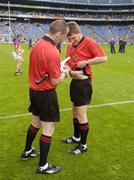 13 June 2004; Referee Barry Kelly has his radio adjusted by linesman Anthony Stapleton, left. Guinness Leinster Senior Hurling Championship Semi-Final, Kilkenny v Wexford, Croke Park, Dublin. Picture credit; Ray McManus / SPORTSFILE