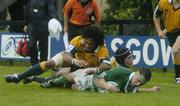 23 June 2004; Glen Telford, Ireland, goes over for a try, despite the attentions of Australia's Chris Siale, left, and Josh Graham. IRB Under 21 World Rugby Championship, Semi-Final, Ireland v Australia, Hughenden, Glasgow, Scotland. Picture credit; Brian Lawless / SPORTSFILE