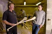24 June 2004; Hurling Matters. As the latest Guinness advertising campaign for the Hurling Championship says &quot;It's part of what we are&quot; and it certanly is in this household. Pictured with father Bernie is Jerry O'Connor of Cork as his brother and Cork captain Ben carves out a hurley in advance of this weekend's Guinness Munster Hurling Final between Cork and Waterford. Picture credit; Brendan Moran / SPORTSFILE