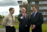 24 June 2004; At the announcement of the allocation of 2 million euro from the Irish Sports Council to the F.A.I. for 2004 aimed at supporting their overall Development Programme are from left to right, Kieran McGeeney, Irish Sports Council, Mr John O'Donoghue T.D, Minister for Arts, Sport and Tourism, and Packie Bonner, FAI Technical Director. O'Devaney Gardens, Dublin. Picture credit; Damien Eagers / SPORTSFILE