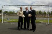 24 June 2004; At the announcement of the allocation of 2 million euro from the Irish Sports Council to the F.A.I. for 2004 aimed at supporting their overall Development Programme are from left to right, Kieran McGeeney, Irish Sports Council, Mr John O'Donoghue T.D, Minister for Arts, Sport and Tourism, and Packie Bonner, FAI Technical Director. O'Devaney Gardens, Dublin. Picture credit; Damien Eagers / SPORTSFILE