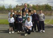24 June 2004; At the announcement of the allocation of 2 million euro from the Irish Sports Council to the F.A.I. for 2004 aimed at supporting their overall Development Programme were the Minister for Arts, Sport and Tourism, Mr John O'Donoghue T.D, with children who took part in the FAI / Dublin Bus Futsal Programme. O'Devaney Gardens, Dublin. Picture credit; Damien Eagers / SPORTSFILE
