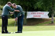 24 June 2004; Val Forde sets up Micheal Mguane, Connaught, on the 18th at the All Ireland Special Olympics Golf Finals, Harbour Point Golf Course, Little Island, Cork. Golf. Picture credit; Gerard McCarthy