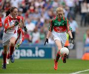 25 August 2013; Sally Moloney, representing Annyalla N.S. Castleblayney, Co. Monaghan, in action against Lauren Curran, representing Brideswell N.S. Athlone, Co. Roscommon, during the INTO/RESPECT Exhibition GoGames at the GAA Football All-Ireland Senior Championship Semi-Final between Mayo and Tyrone. Croke Park, Dublin. Picture credit: Oliver McVeigh / SPORTSFILE