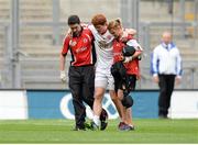 25 August 2013; Peter Harte, Tyrone, is escorted off the pitch by physio Michael Harte and team doctor Dr. Liz O'Brien, after picking up an injury in the fifth minute. GAA Football All-Ireland Senior Championship Semi-Final, Mayo v Tyrone, Croke Park, Dublin. Picture credit: Brendan Moran / SPORTSFILE