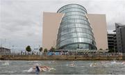 24 August 2013; Swimmers pass the National Convention Centre during the 94th Dublin City Liffey Swim. River Liffey, Dublin. Picture credit: Brian Lawless / SPORTSFILE