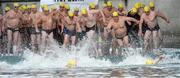24 August 2013; Swimmers struggle to stay on their feet at the start of the 94th Dublin City Liffey Swim. River Liffey, Dublin. Picture credit: Brian Lawless / SPORTSFILE