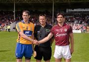 28 July 2013; Clare captain Patrick Donnellan and Galway captain Fergal Moore shake hands in front of referee Brian Gavin. GAA Hurling All-Ireland Senior Championship, Quarter-Final, Galway v Clare, Semple Stadium, Thurles, Co. Tipperary. Picture credit: Ray McManus / SPORTSFILE