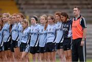 14 August 2013; Dublin manager Conor Barry stands with his players for the National Anthem. All-Ireland Ladies Minor A Championship Final Replay, Dublin v Galway, Cusack Park, Mullingar, Co. Westmeath. Picture credit: Brian Lawless / SPORTSFILE