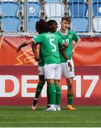 17 May 2023; Ike Orazi of Republic of Ireland, centre, celebrates with teammates Jake Grante, 5, and Mason Melia after scoring his side's first goal during the UEFA European U17 Championship Final Tournament match between Republic of Ireland and Poland at Hidegkuti Nándor Stadion in Budapest, Hungary. Photo by Laszlo Szirtesi/Sportsfile