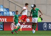17 May 2023; Jake Grante of Republic of Ireland in action against Oskar Tomczyk of Poland during the UEFA European U17 Championship Final Tournament match between Republic of Ireland and Poland at Hidegkuti Nándor Stadion in Budapest, Hungary. Photo by Laszlo Szirtesi/Sportsfile