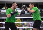 17 May 2023; Dennis Hogan and coach Zach Bacigalupo during public workouts, held at Dundrum Town Centre in Dublin, ahead of his IBO world super-welterweight title fight with James Metcalf, on May 20th at 3Arena in Dublin. Photo by Stephen McCarthy/Sportsfile